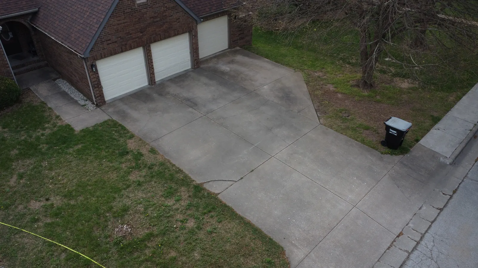 Dirty concrete driveway before pressure washing