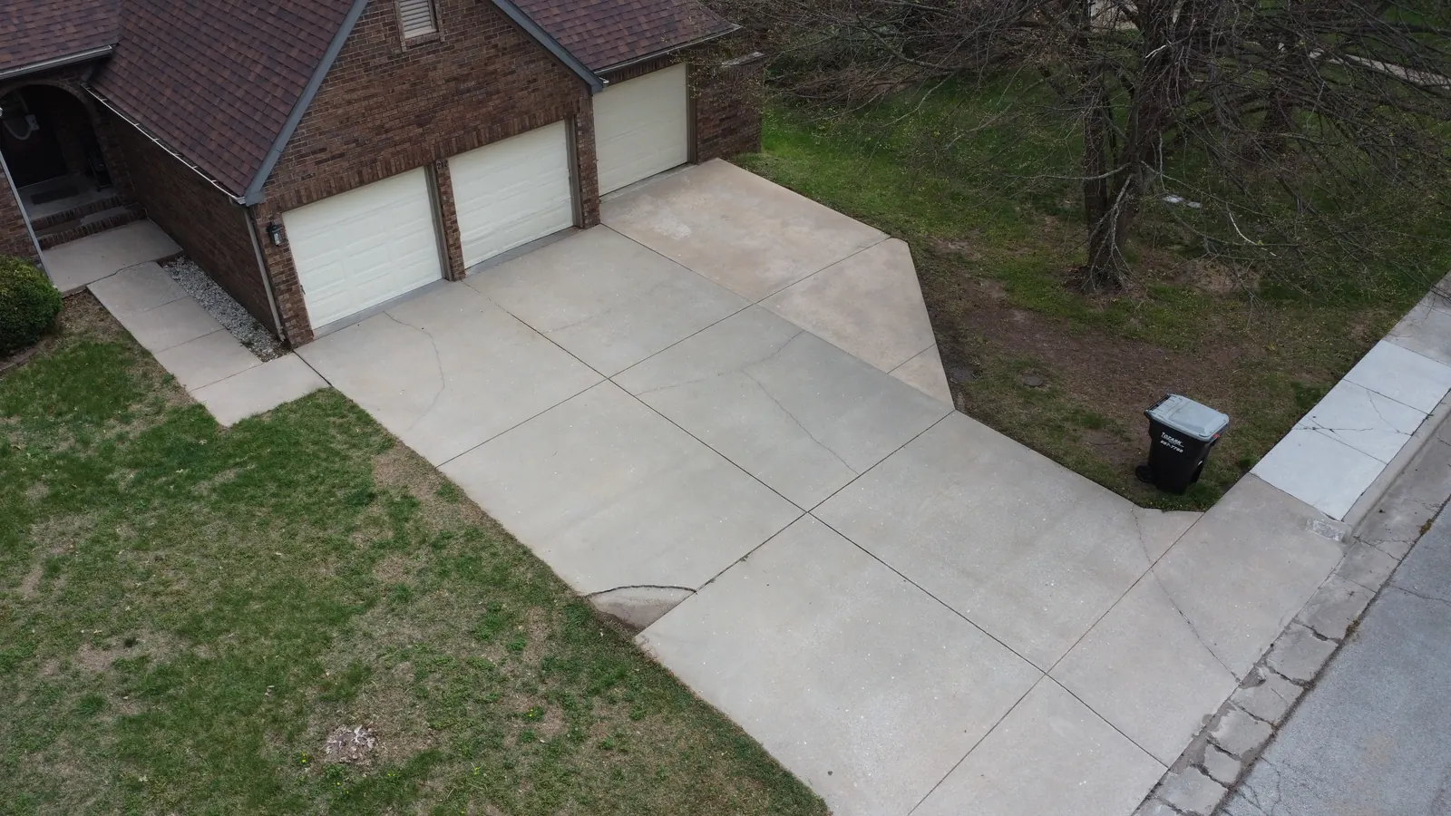 Bright clean concrete driveway after pressure washing