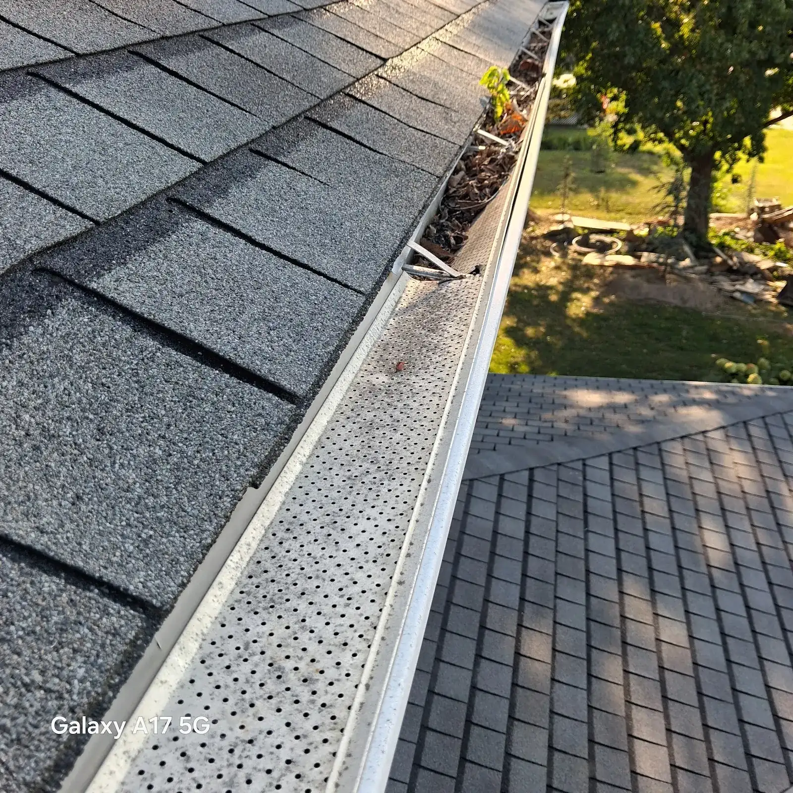 Gutter guards installed along a home roof