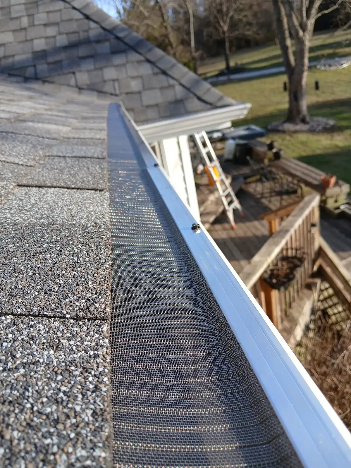 A long run of clean gutter guard after installation