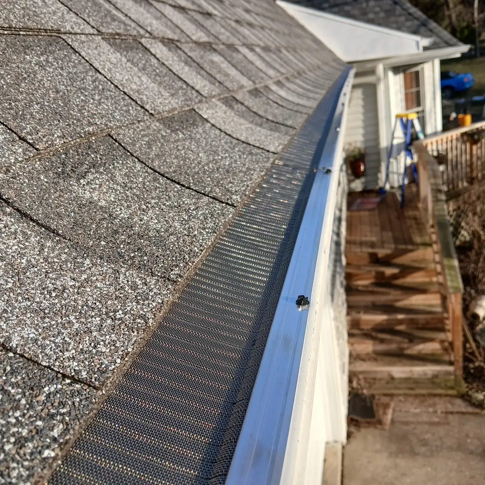 A clean gutter guard installed along a roofline