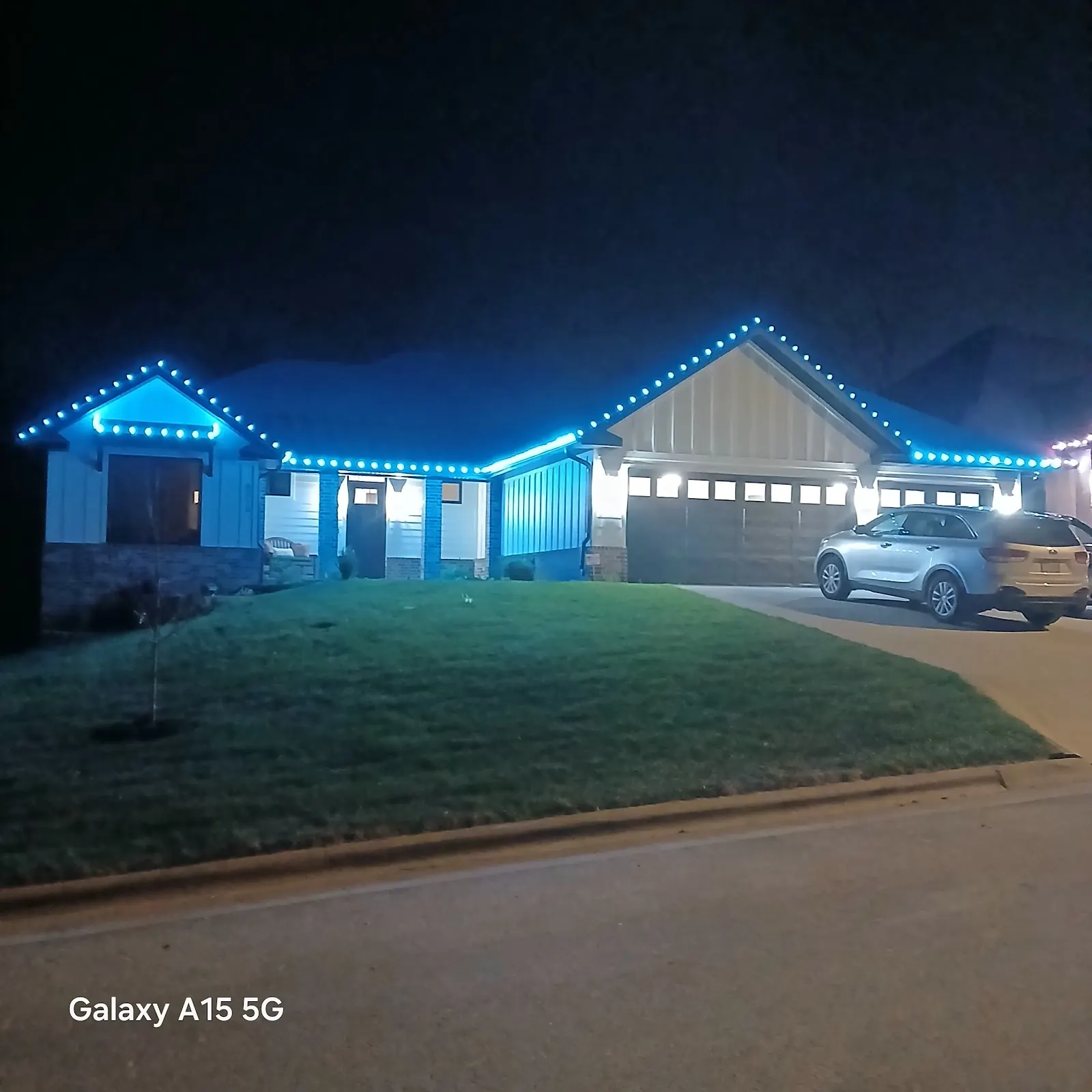 A home glowing in blue permanent lighting