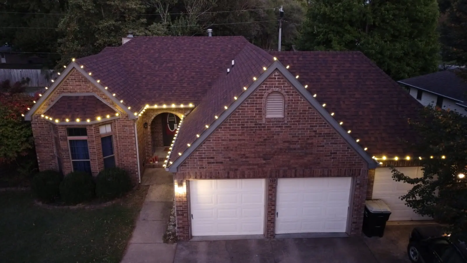 Colorful holiday lights installed on a Springfield home