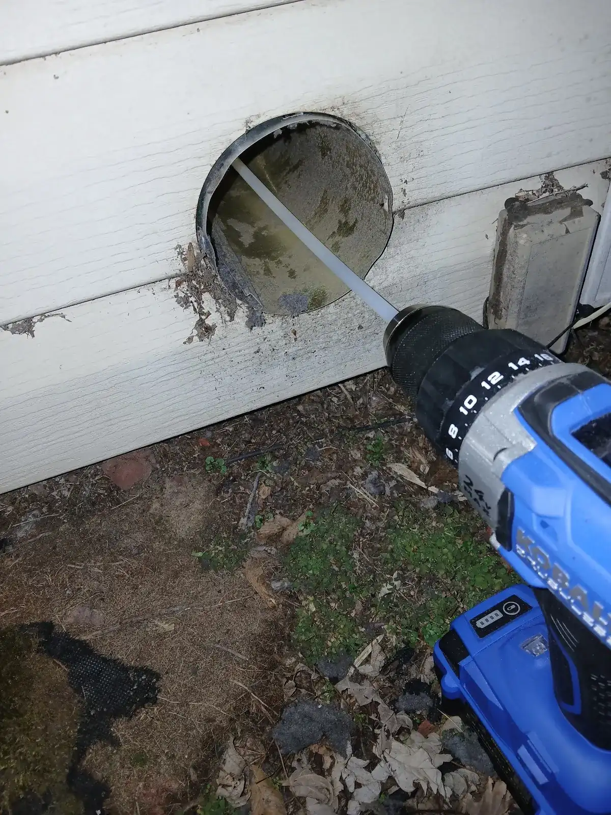 Professional rotary dryer vent cleaning equipment in use